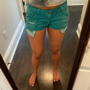 Carmar designer shorts in turquoise.